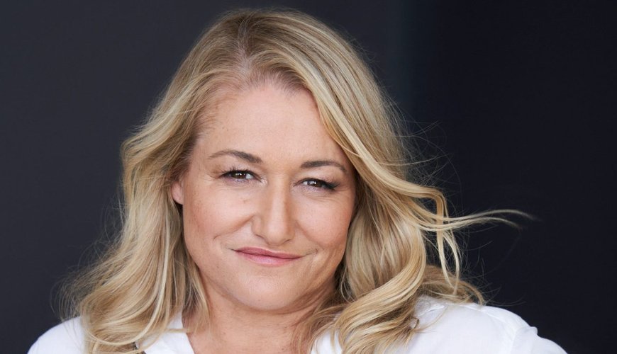 Raelle Tucker's Magical World Leap: TV Genius Spins Debut Novel with Crown